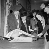 League of Women Voters of McLean County members evaluate maps for Bloomington-Normal housing survey, circa December 1943